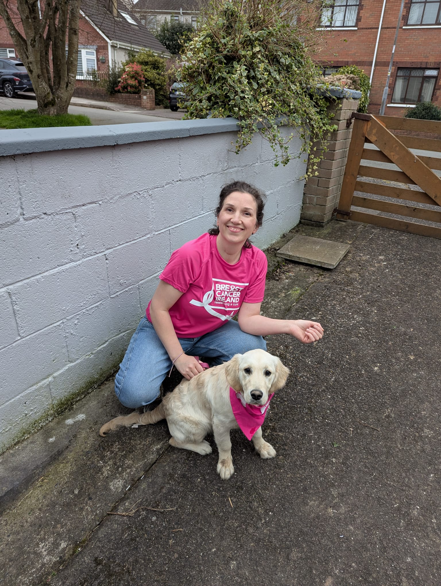 Impi sitting with a golden retriever